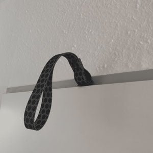 The Body Wisdom Sling Trainer Anywhere Anchor used as a door anchor- opening of the door and setting up the door anchor 300x300